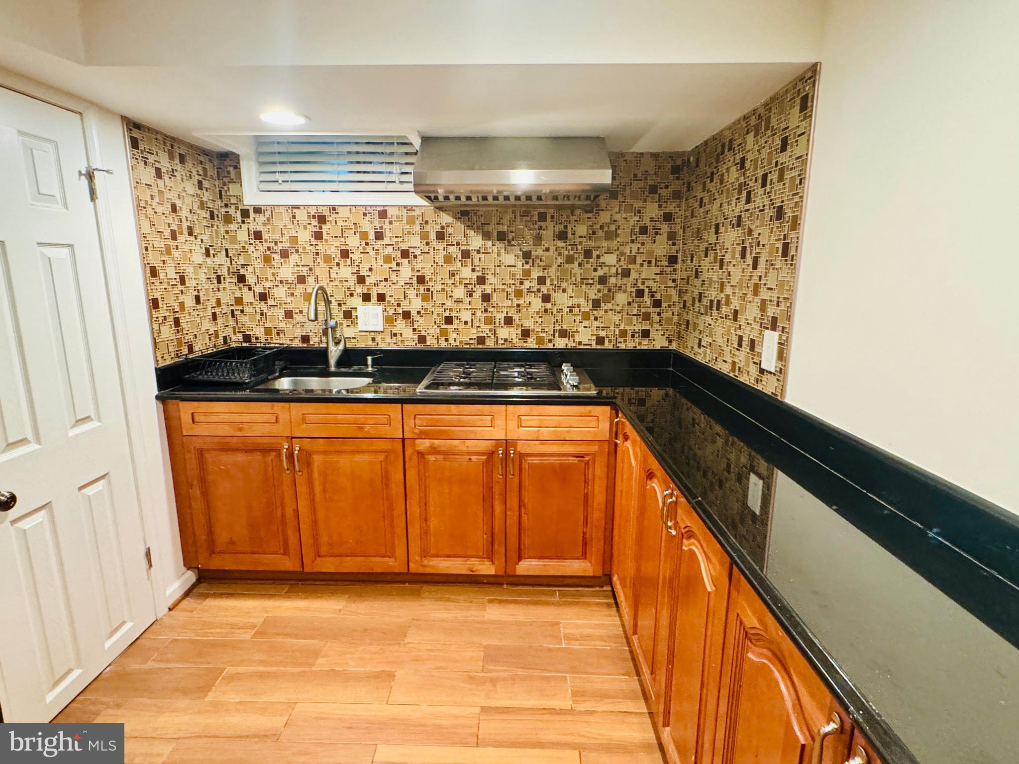 3902 Hadley Square West Baltimore, MD 21218 - Photo 28 of 38 a view of entryway with wooden floor