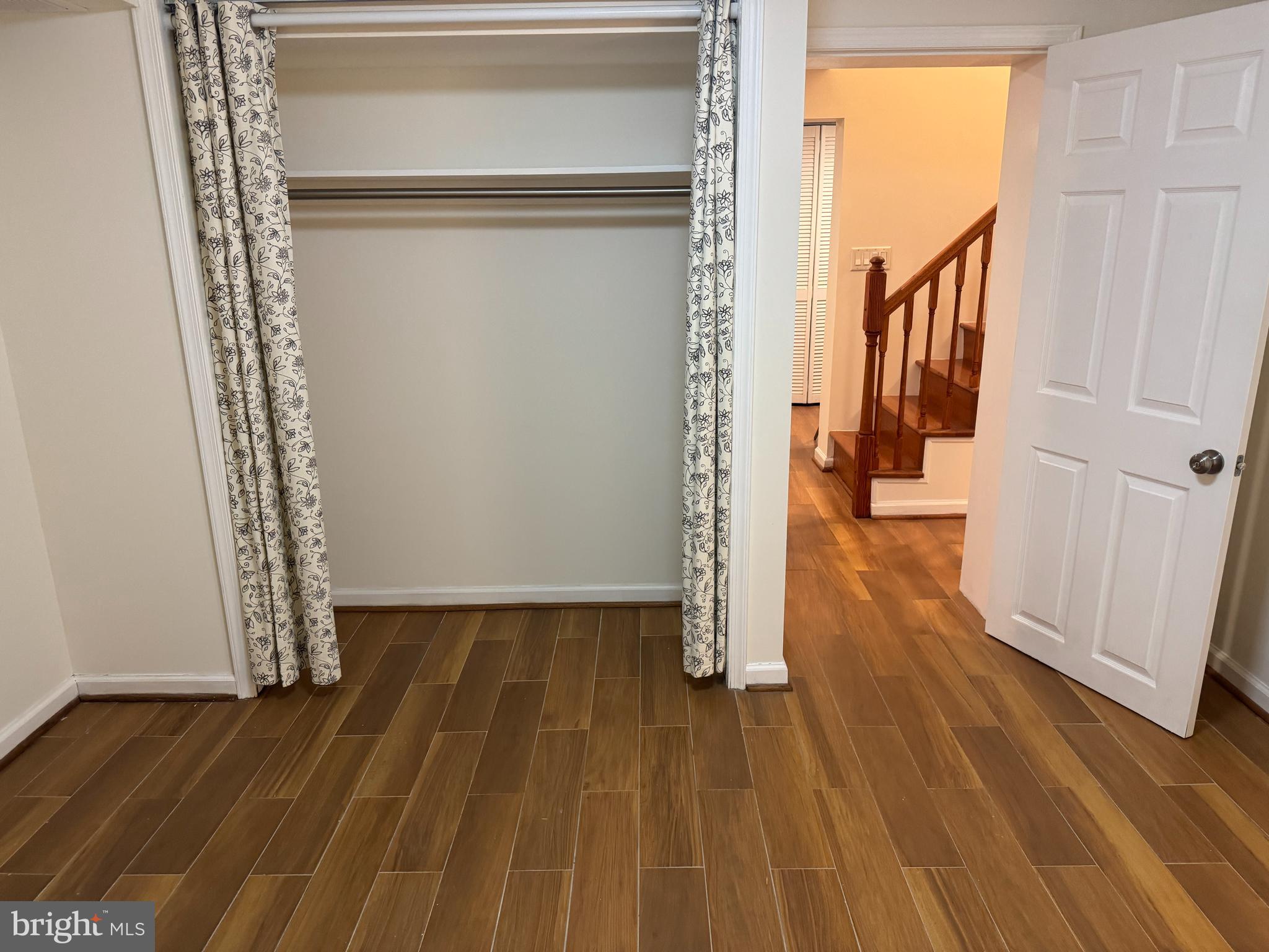 3902 Hadley Square West Baltimore, MD 21218 - Photo 30 of 38 a view of a room with wooden floor and door