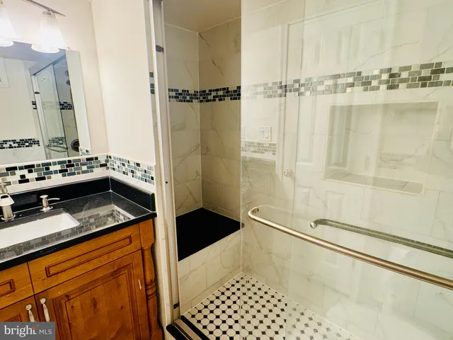 a kitchen with a sink a stove and a microwave