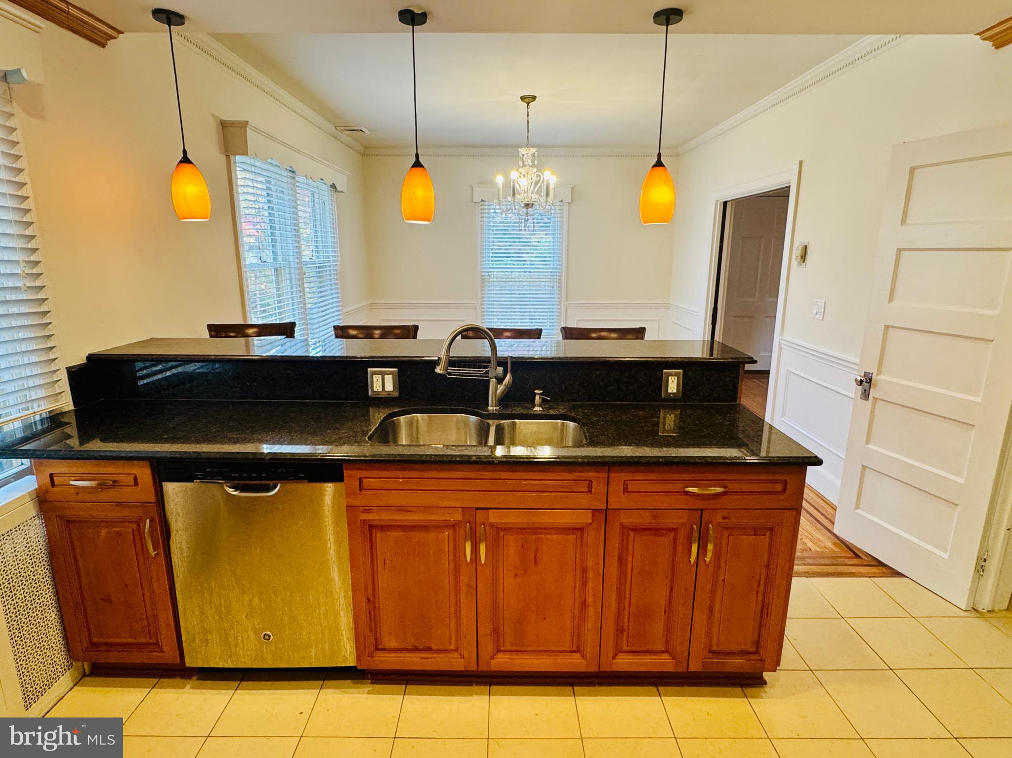 3902 Hadley Square West Baltimore, MD 21218 - Photo 7 of 38 a kitchen with a sink and cabinets