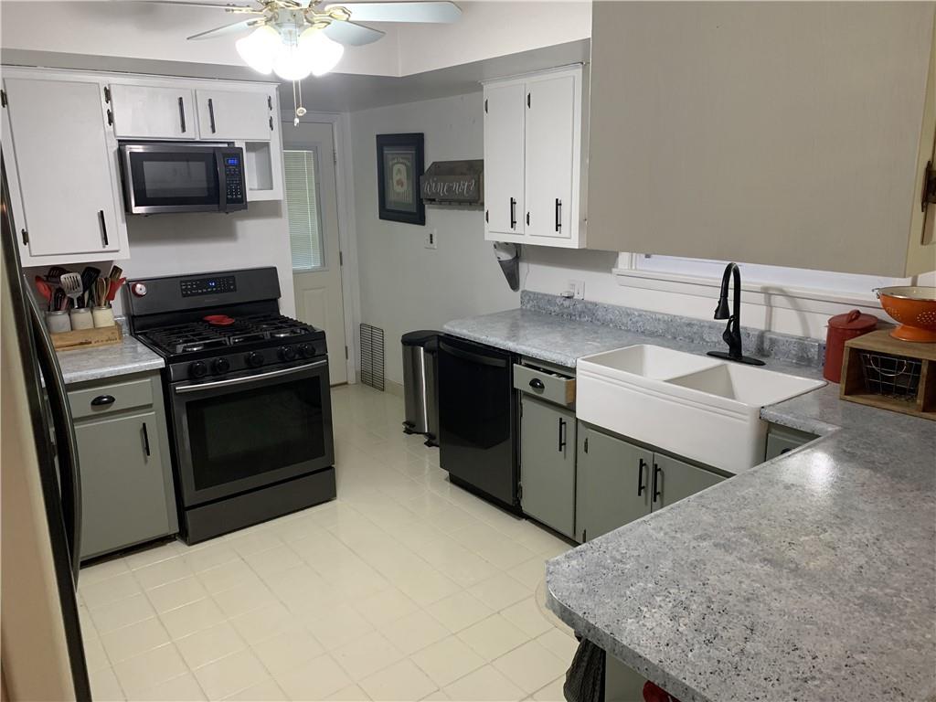 108 Wise Road Butler, PA 16002 - Photo 3 of 25 a kitchen that has a sink and a stove in it