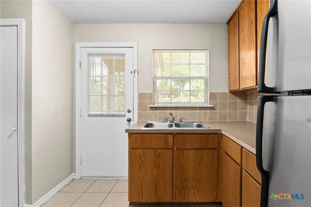 a bathroom with a sink and a window