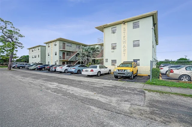 a view of a cars parked in front of a house