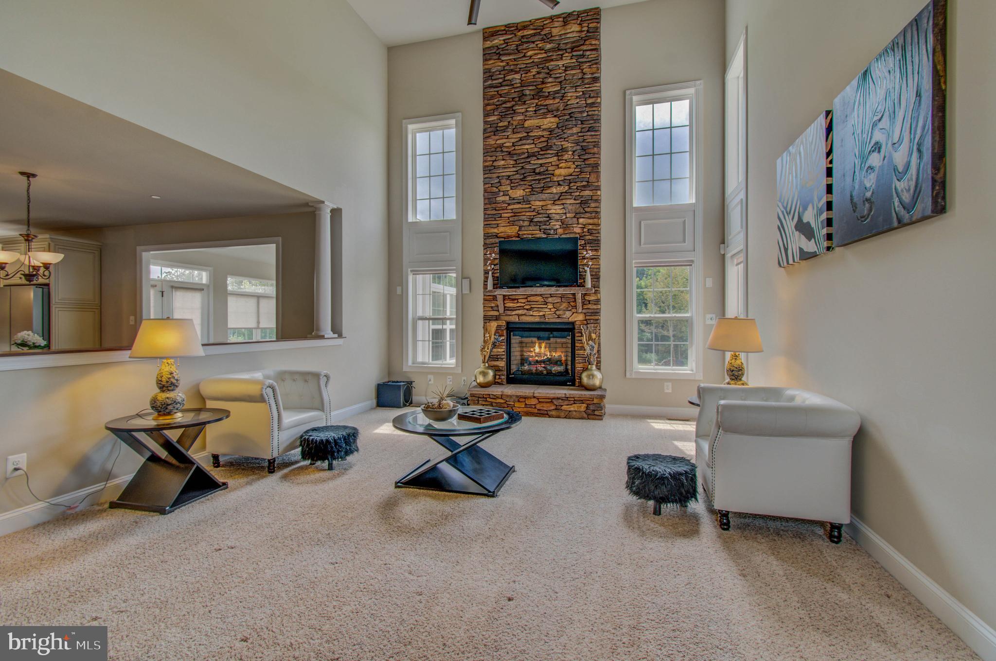 3188 Huntsman Drive Huntingtown, MD 20639 - Photo 19 of 98 a living room with furniture and a fireplace