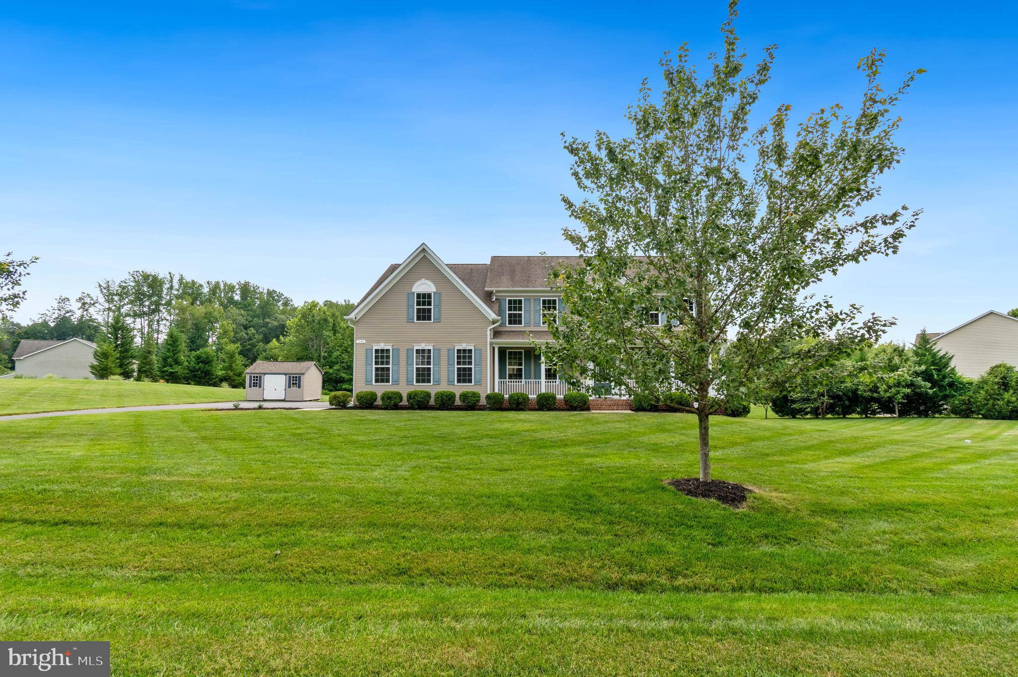 3188 Huntsman Drive Huntingtown, MD 20639 - Photo 2 of 98 a front view of a house with a yard