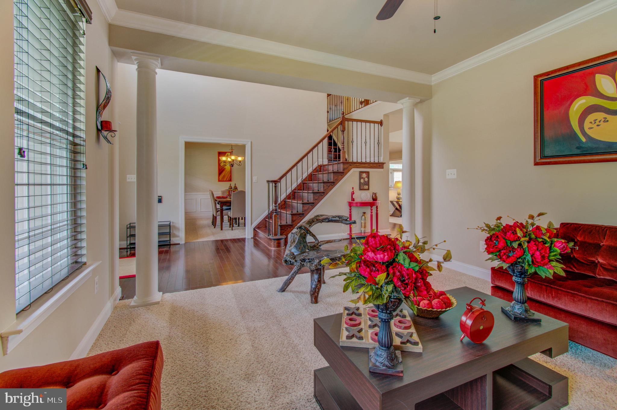 3188 Huntsman Drive Huntingtown, MD 20639 - Photo 24 of 98 a living room with furniture and flowers