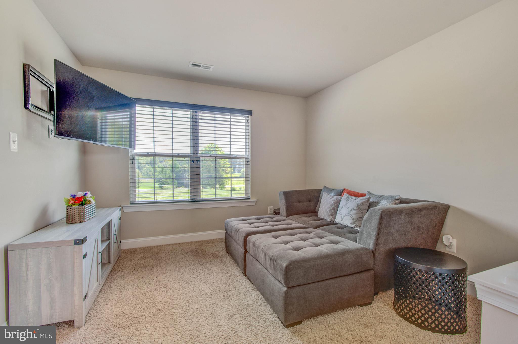 3188 Huntsman Drive Huntingtown, MD 20639 - Photo 35 of 98 a living room with furniture and a window