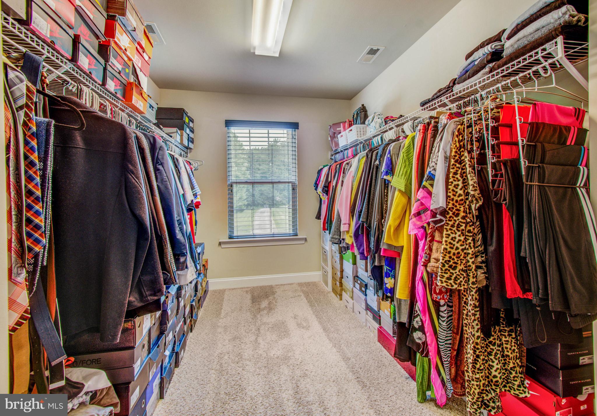 3188 Huntsman Drive Huntingtown, MD 20639 - Photo 41 of 98 a view of walk in closet with clothes