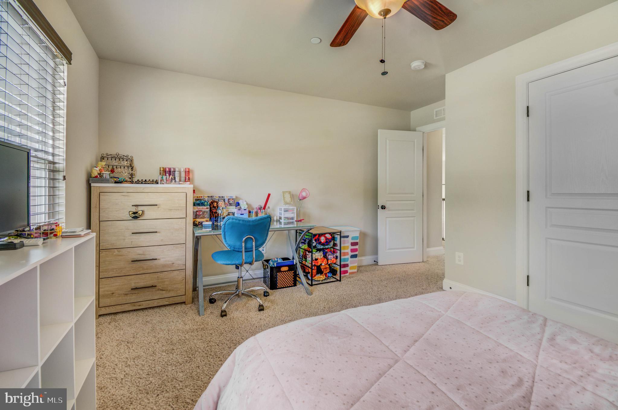 3188 Huntsman Drive Huntingtown, MD 20639 - Photo 44 of 98 a bed room with a bed and a flat tv screen