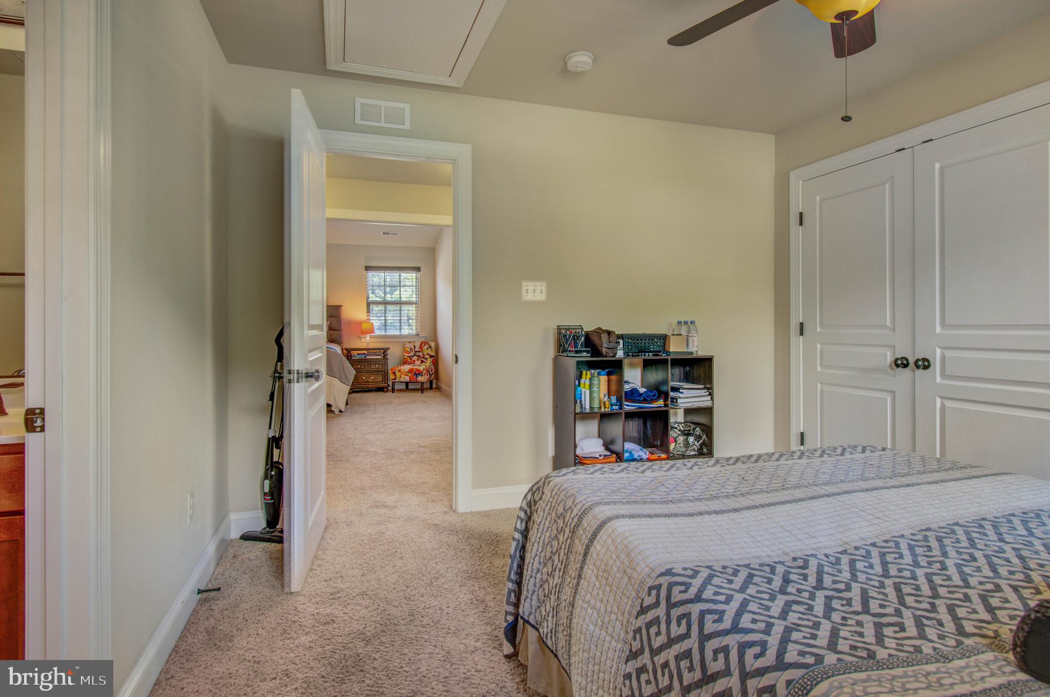 3188 Huntsman Drive Huntingtown, MD 20639 - Photo 46 of 98 a bedroom with a bed and a chandelier