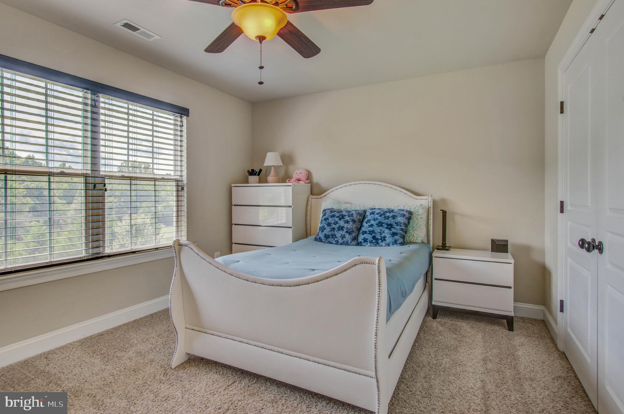 3188 Huntsman Drive Huntingtown, MD 20639 - Photo 48 of 98 a bedroom with a bed and a large window
