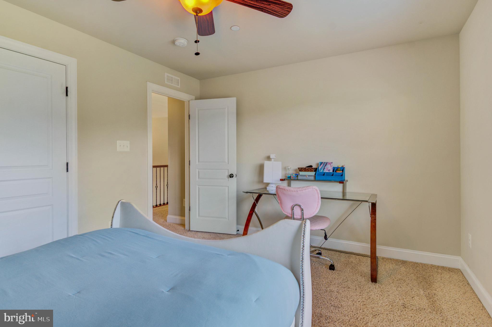 3188 Huntsman Drive Huntingtown, MD 20639 - Photo 49 of 98 a workspace room with a bed and furniture