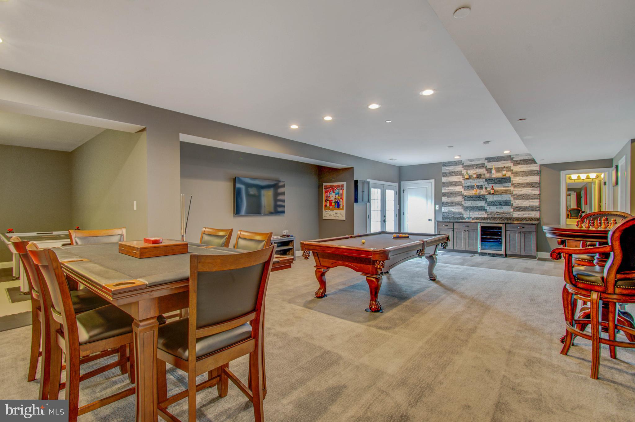 3188 Huntsman Drive Huntingtown, MD 20639 - Photo 54 of 98 a dining room with a table and chairs