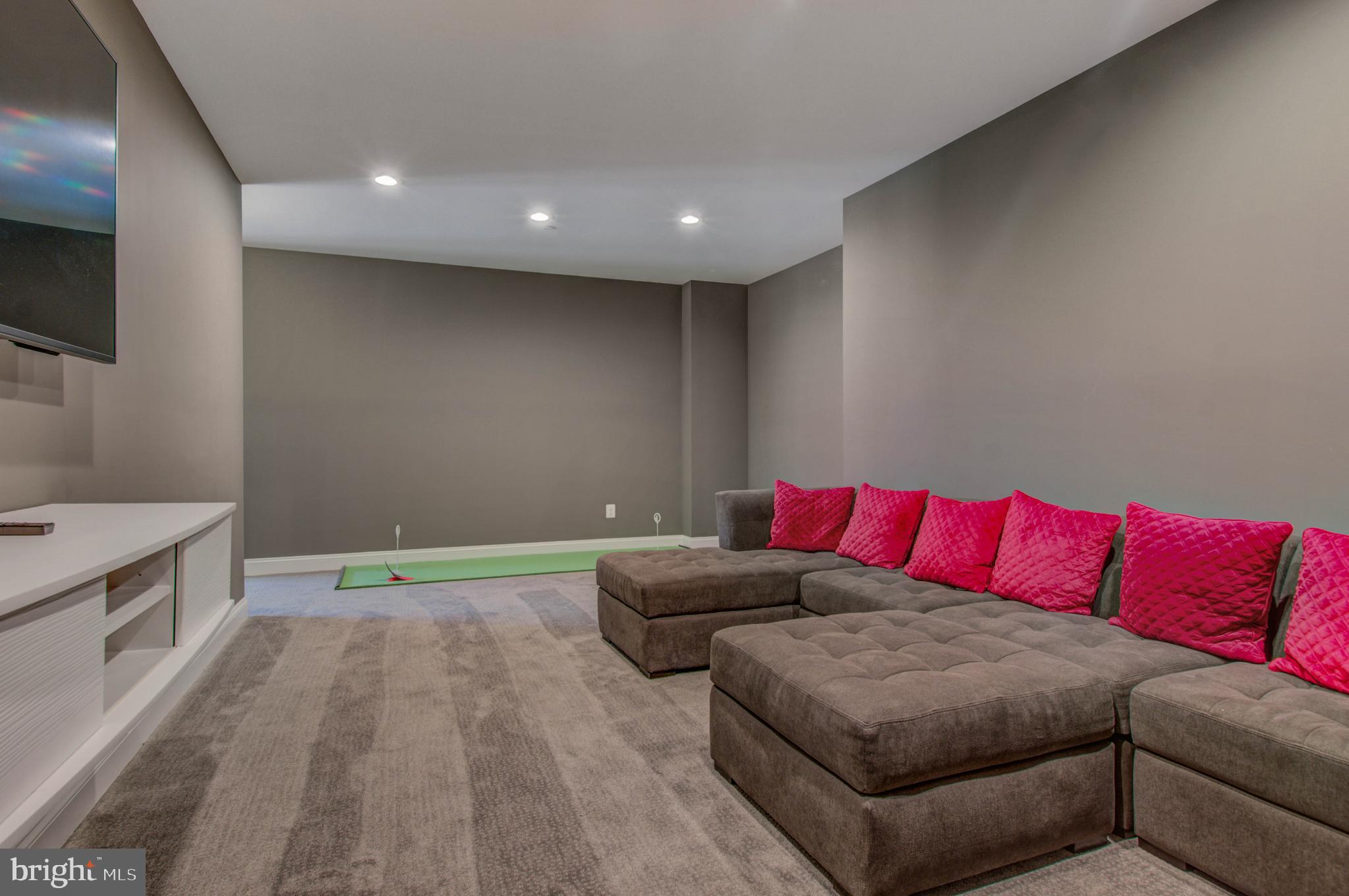 3188 Huntsman Drive Huntingtown, MD 20639 - Photo 60 of 98 a living room with a couch and a flat screen tv