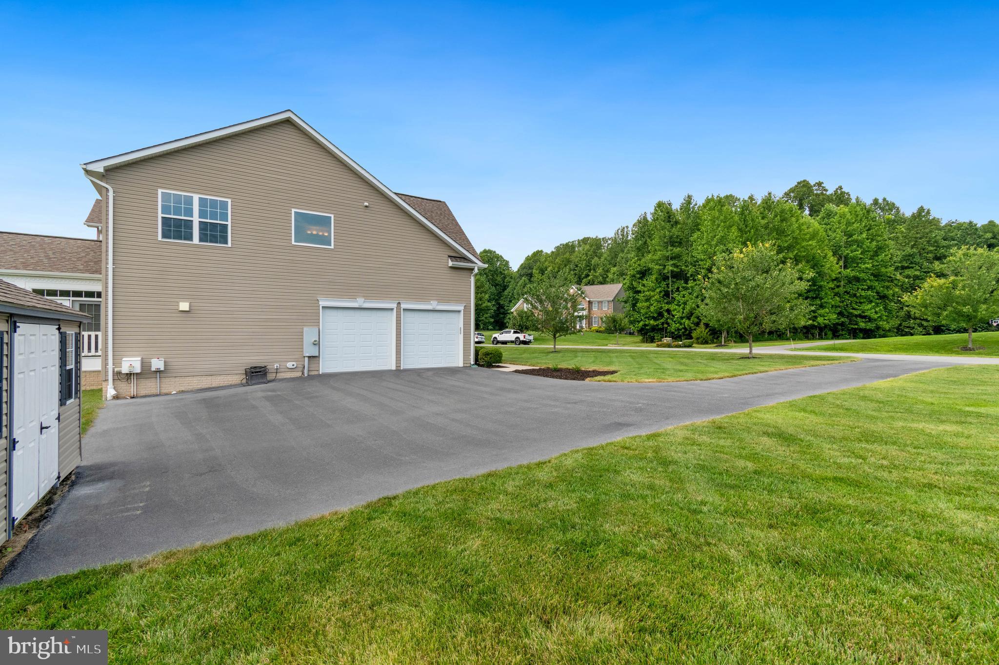 3188 Huntsman Drive Huntingtown, MD 20639 - Photo 68 of 98 a view of a house with a yard and a garage