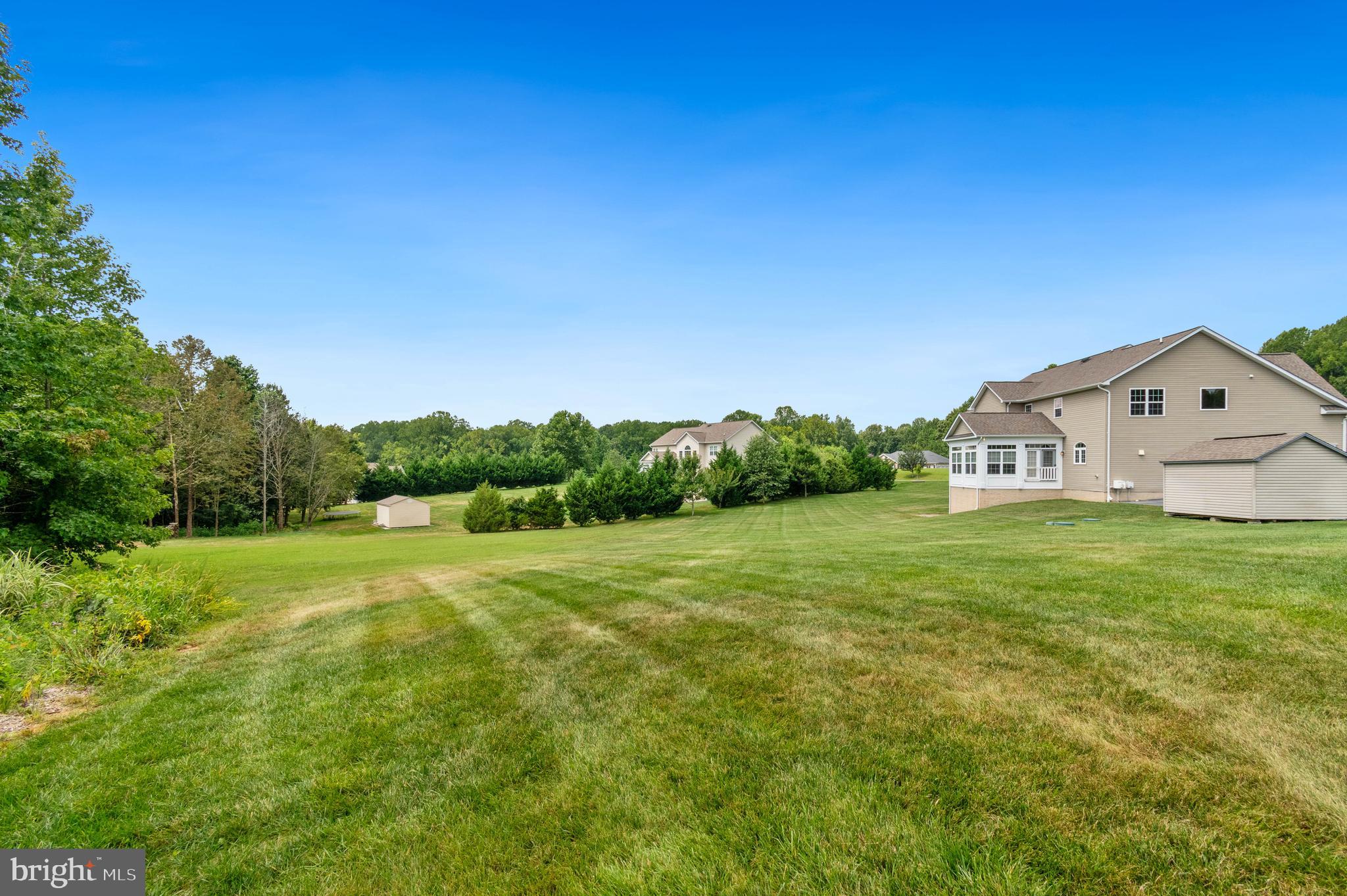 3188 Huntsman Drive Huntingtown, MD 20639 - Photo 70 of 98 a view of a big yard with a house in the background