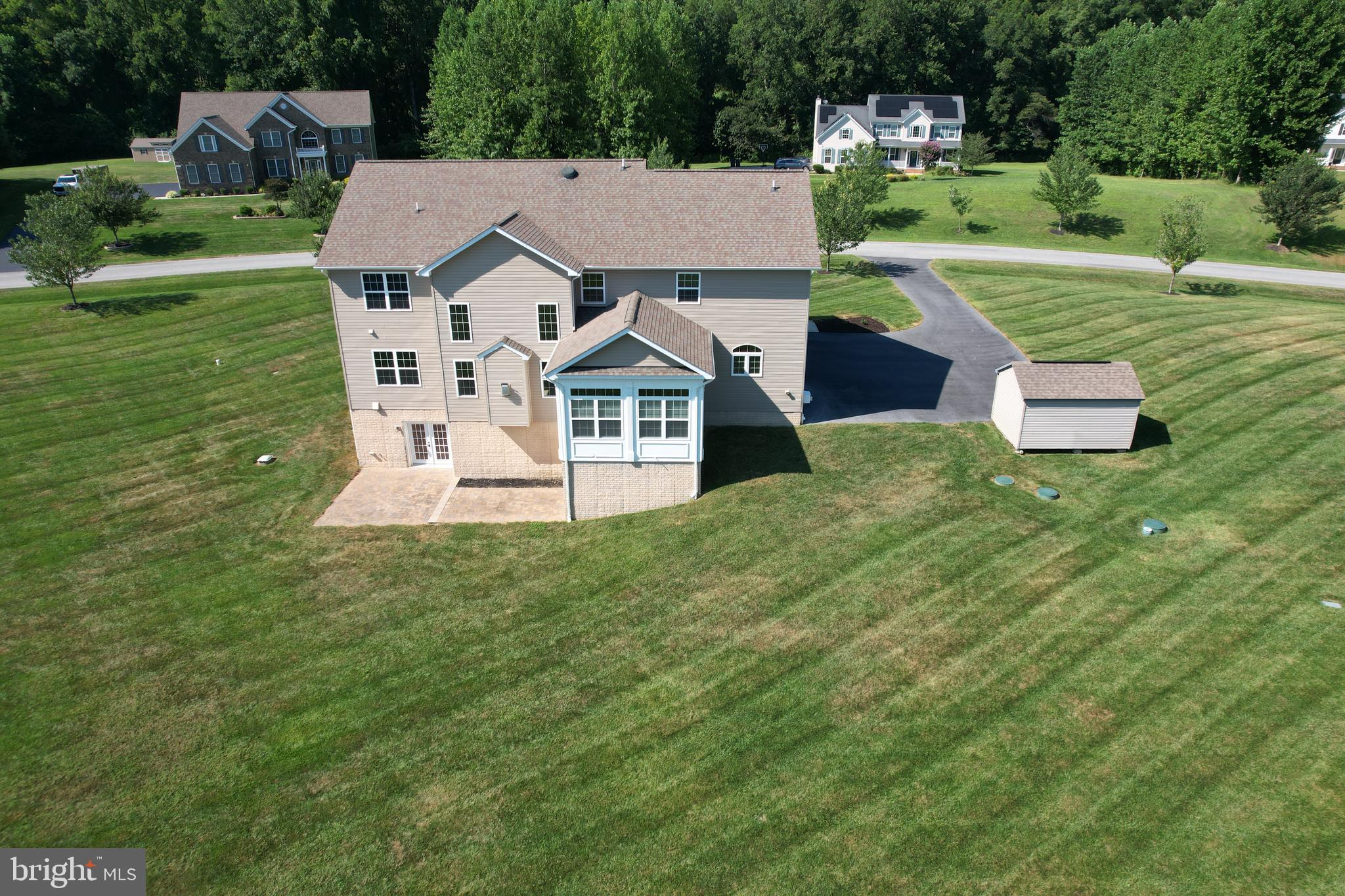 3188 Huntsman Drive Huntingtown, MD 20639 - Photo 94 of 98 a aerial view of a house with a yard table and chairs
