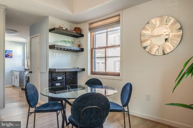 a view of a livingroom with furniture and a fireplace