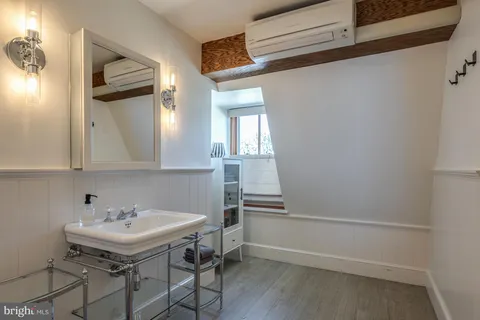 a terrace with a bench and chairs