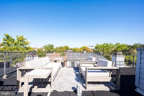 a view of a backyard with sitting area