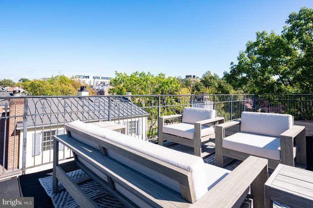 a view of a house with a tree
