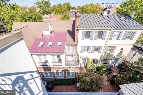 a view of a chairs and tables in the back of a house