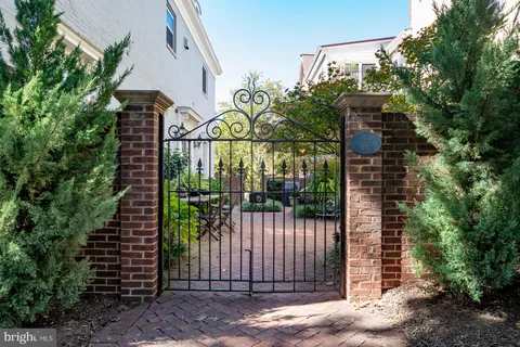 a view of a hallway with a livingroom and couch