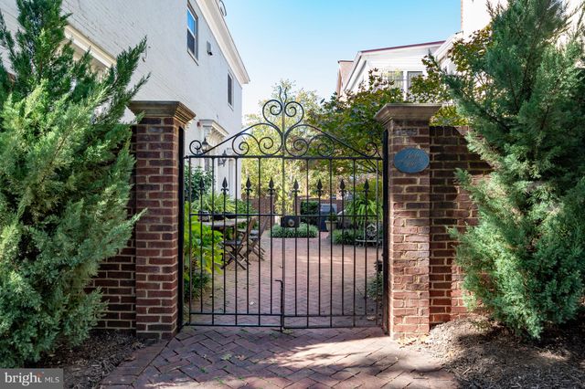 a view of a hallway with a livingroom and couch