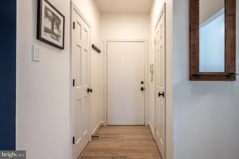 a kitchen with a refrigerator and a stove