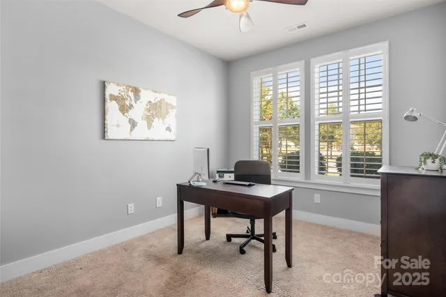 a bedroom with a large bed and dresser