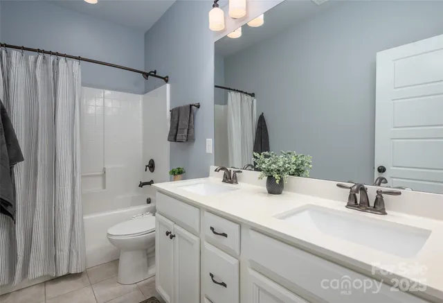 a living room with furniture a flat screen tv and a large window