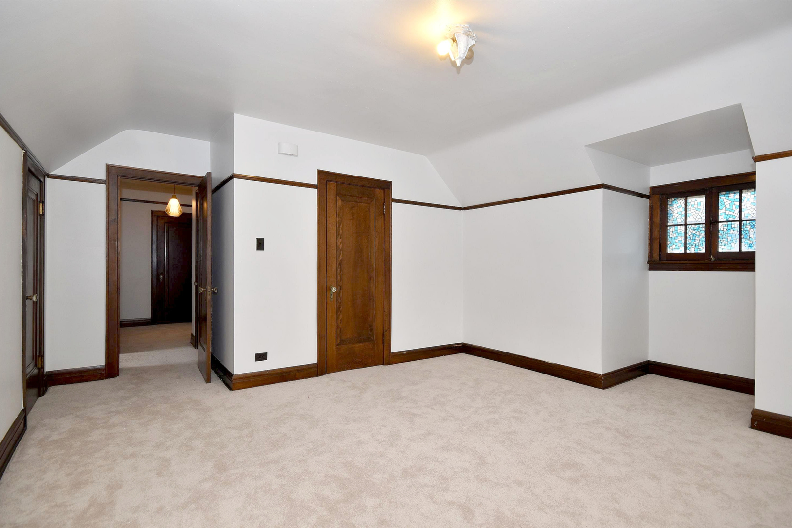 203 Ridgewood Road Riverside, IL 60546 - Photo 9 of 28 a view of an empty room with a fireplace