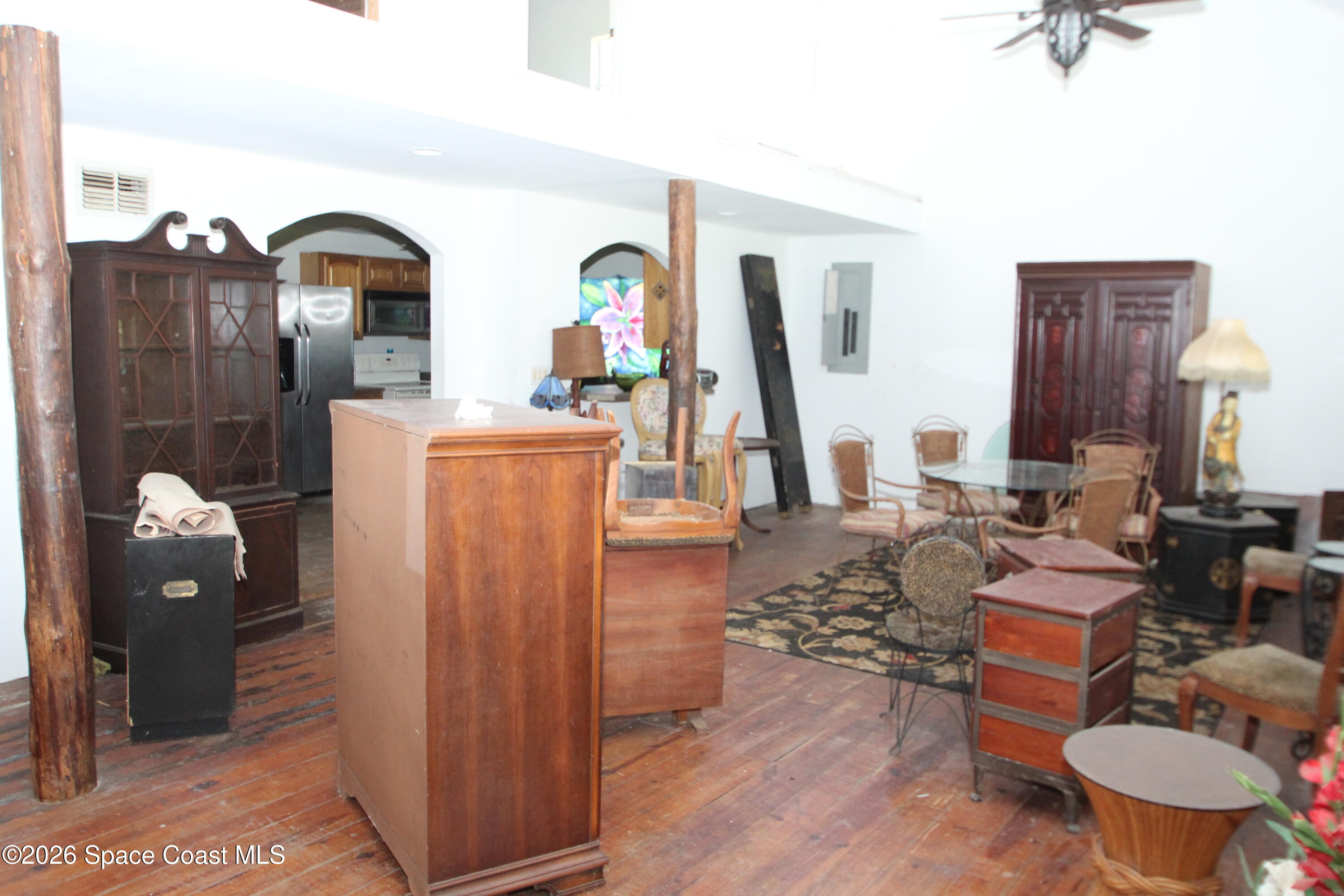 6480 Highway 46 Mims, FL 32754 - Photo 11 of 29 a living room with furniture a rug and white walls