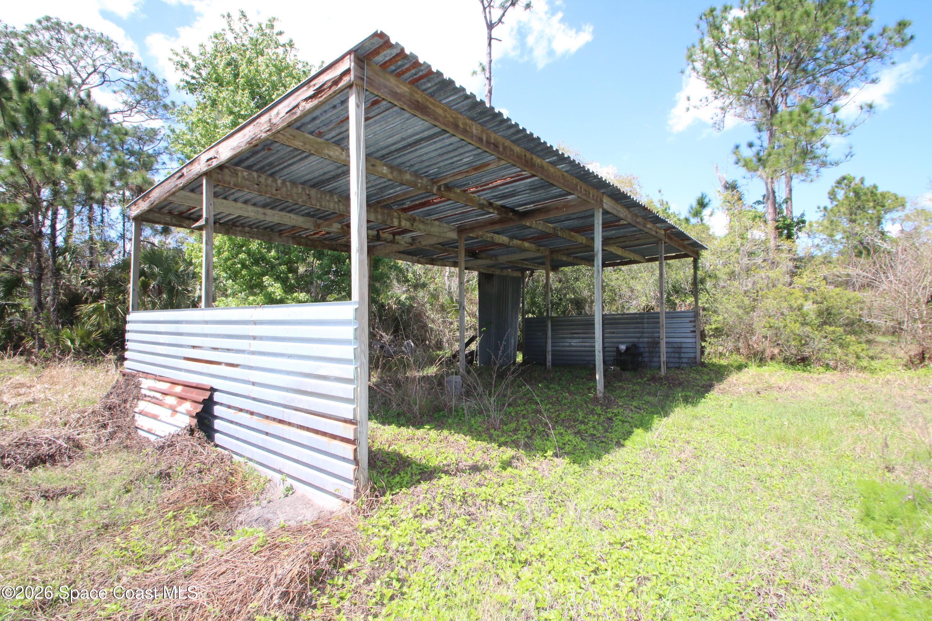 6480 Highway 46 Mims, FL 32754 - Photo 16 of 29 a view of a backyard with a patio