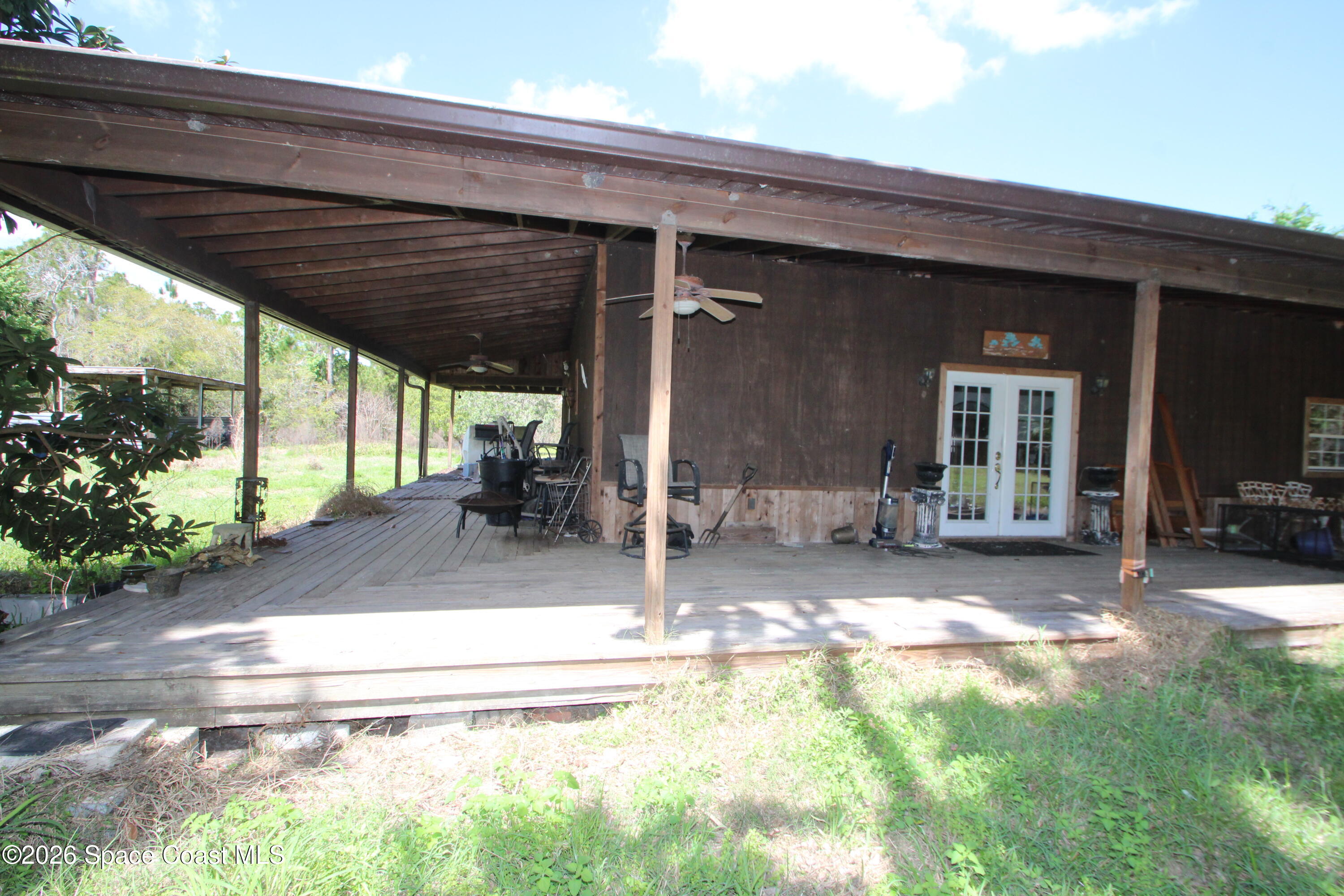 6480 Highway 46 Mims, FL 32754 - Photo 2 of 29 a view of a house with backyard and sitting area
