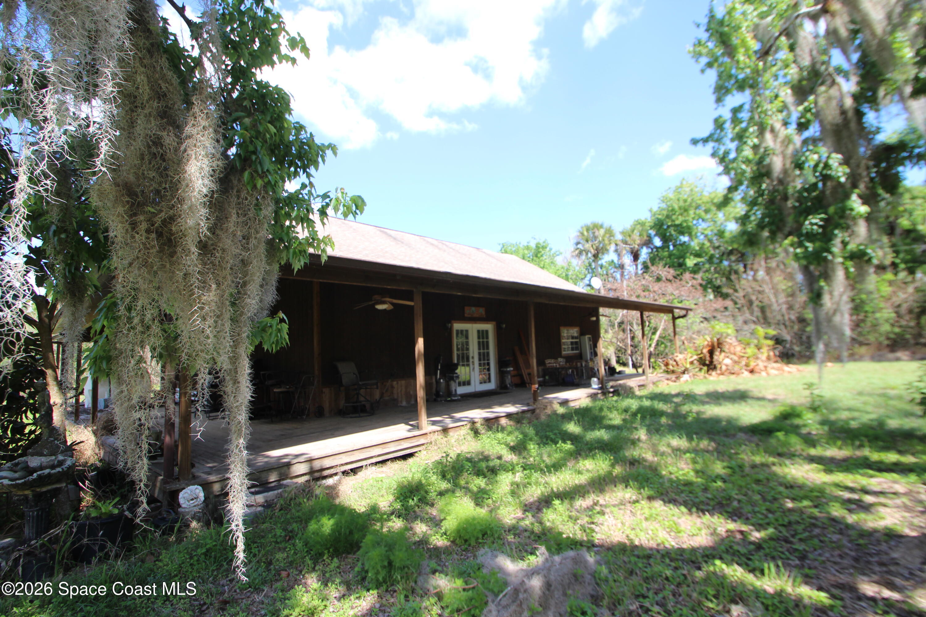 6480 Highway 46 Mims, FL 32754 - Photo 3 of 29 a house with trees in front of it