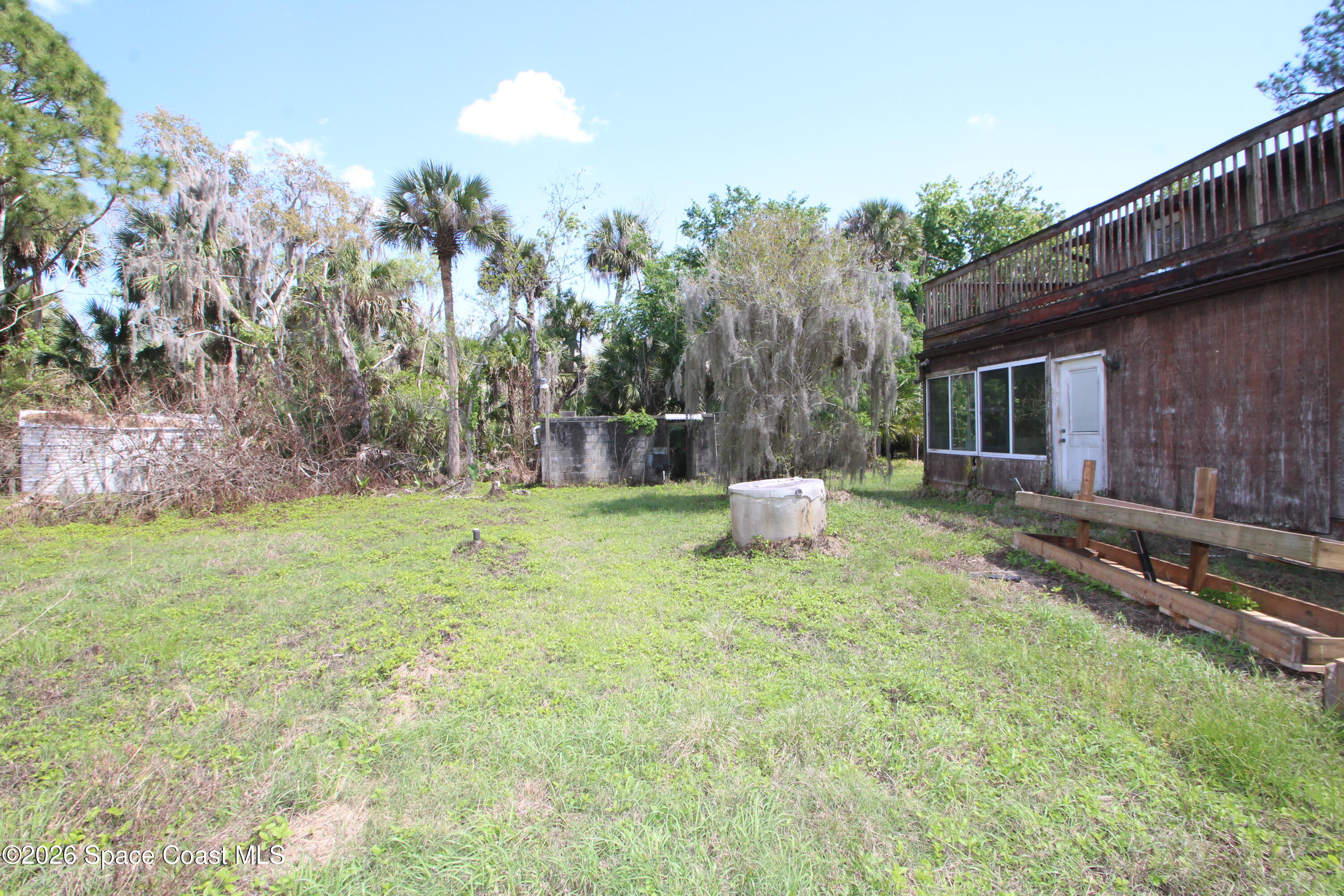 6480 Highway 46 Mims, FL 32754 - Photo 5 of 29 a house view with a sitting space and garden view