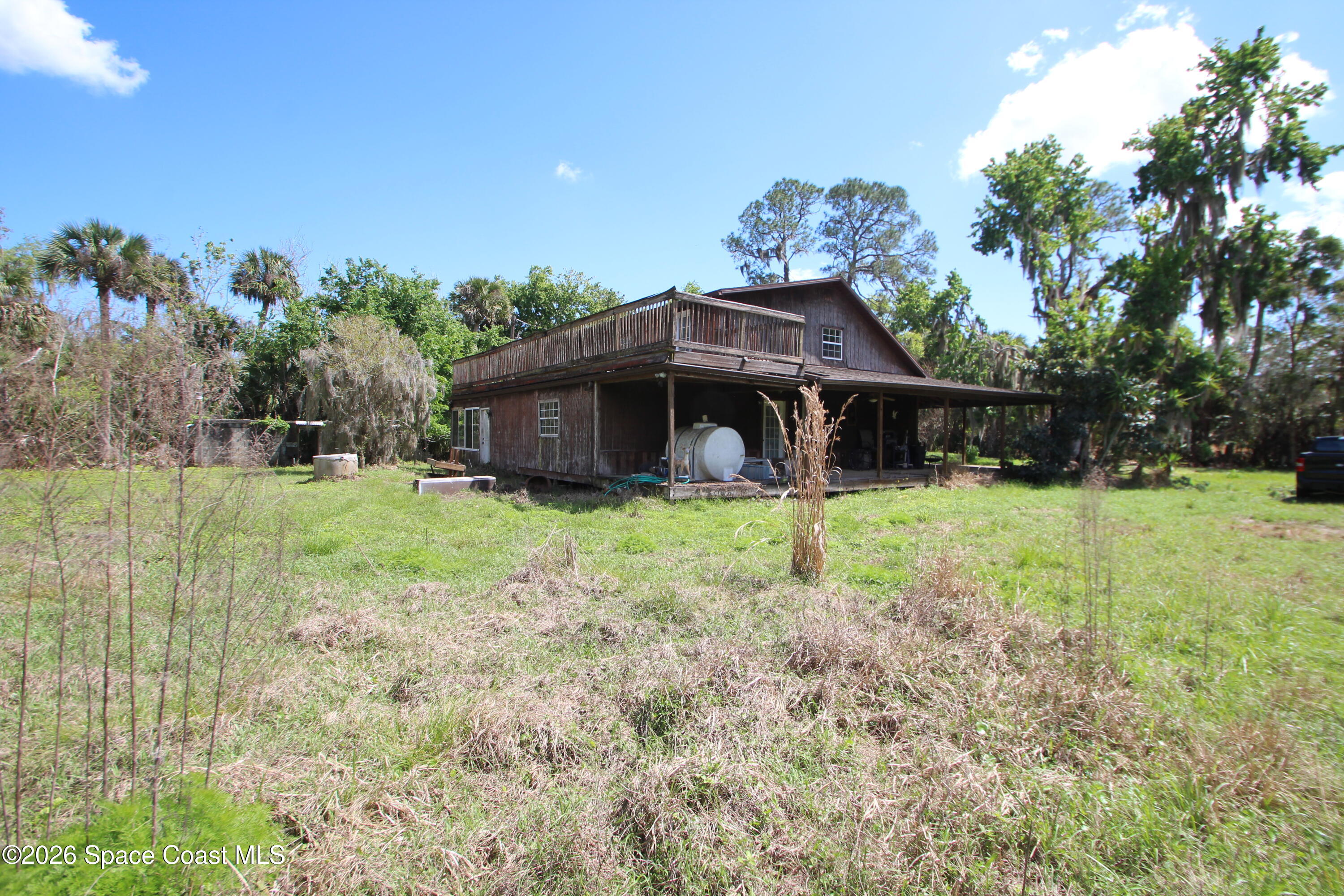 6480 Highway 46 Mims, FL 32754 - Photo 7 of 29 a front view of a house with garden