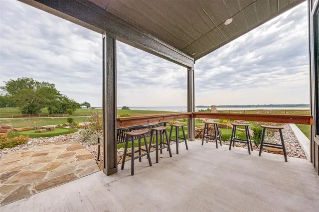 a front view of a house with a yard table and chairs