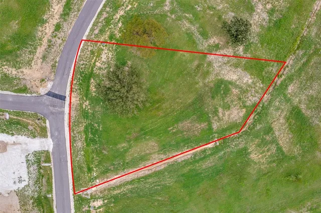 a view of a yard with a lake view