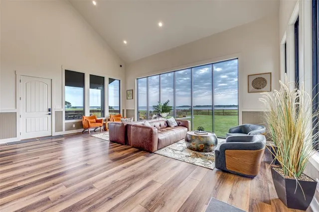 a living room with furniture and wooden floor