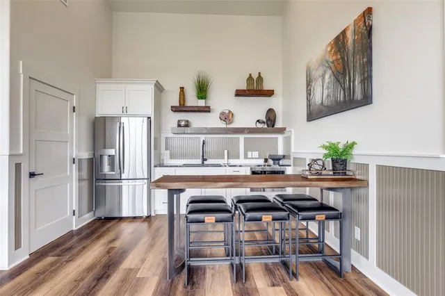 a view of a patio with a table and chairs