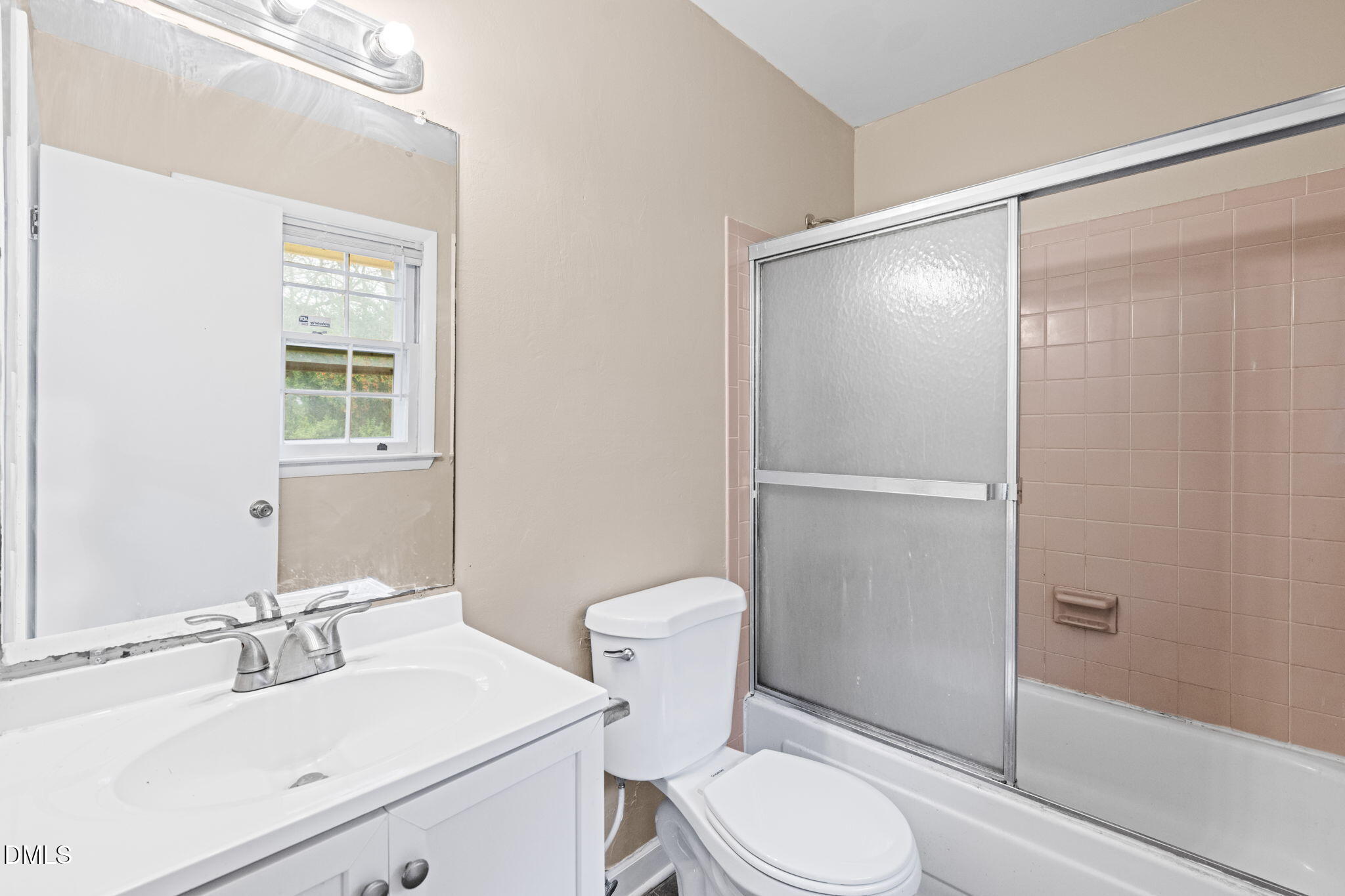 3712 Huntleigh Drive Raleigh, NC 27604 - Photo 18 of 36 a bathroom with a sink toilet vanity and shower