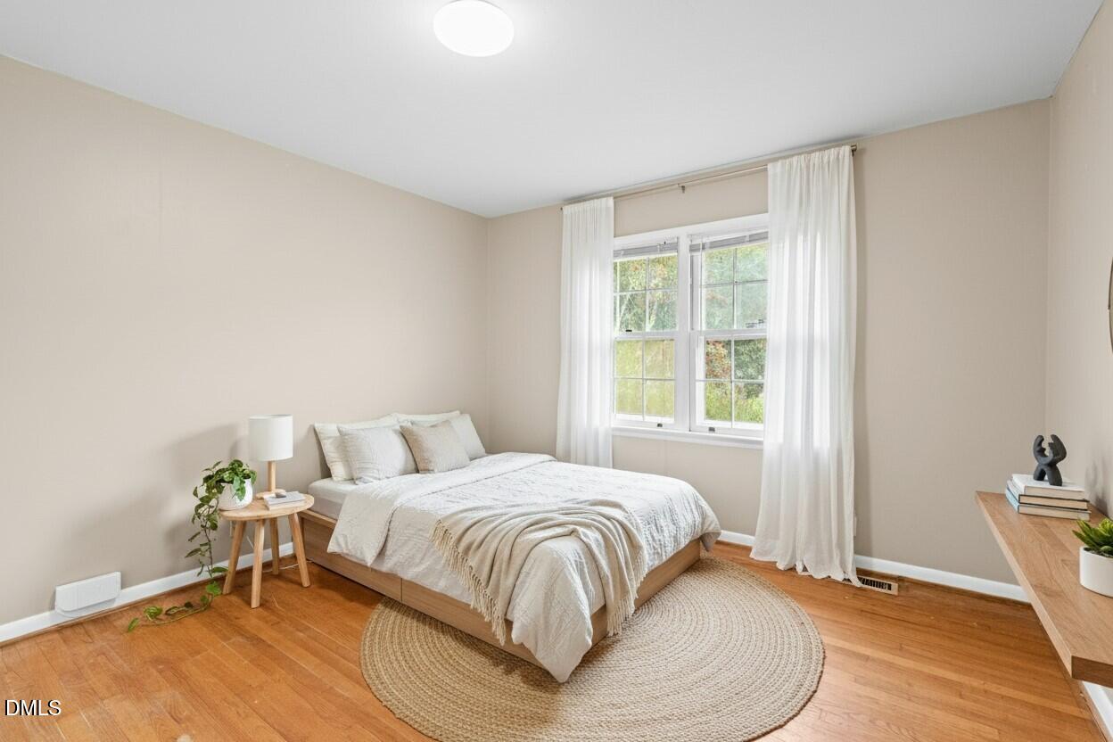 3712 Huntleigh Drive Raleigh, NC 27604 - Photo 20 of 36 a bedroom with a bed and a window