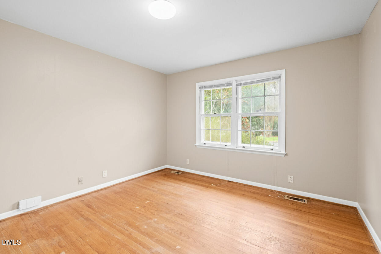 3712 Huntleigh Drive Raleigh, NC 27604 - Photo 21 of 36 an empty room with a window