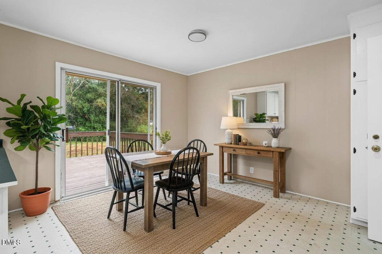 3712 Huntleigh Drive Raleigh, NC 27604 - Photo 6 of 36 a view of a dining room with furniture and window