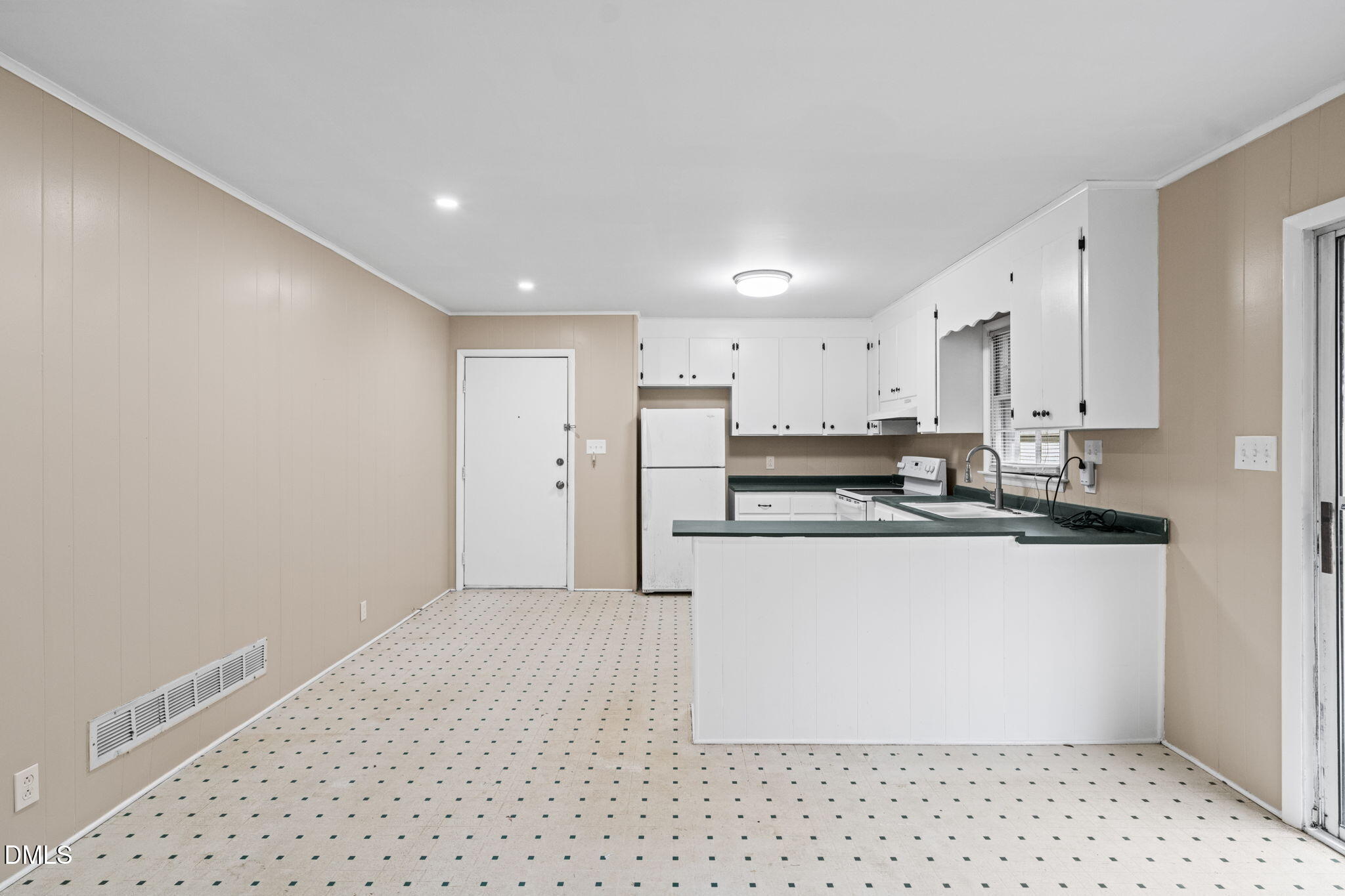 3712 Huntleigh Drive Raleigh, NC 27604 - Photo 8 of 36 a large white kitchen with stainless steel appliances