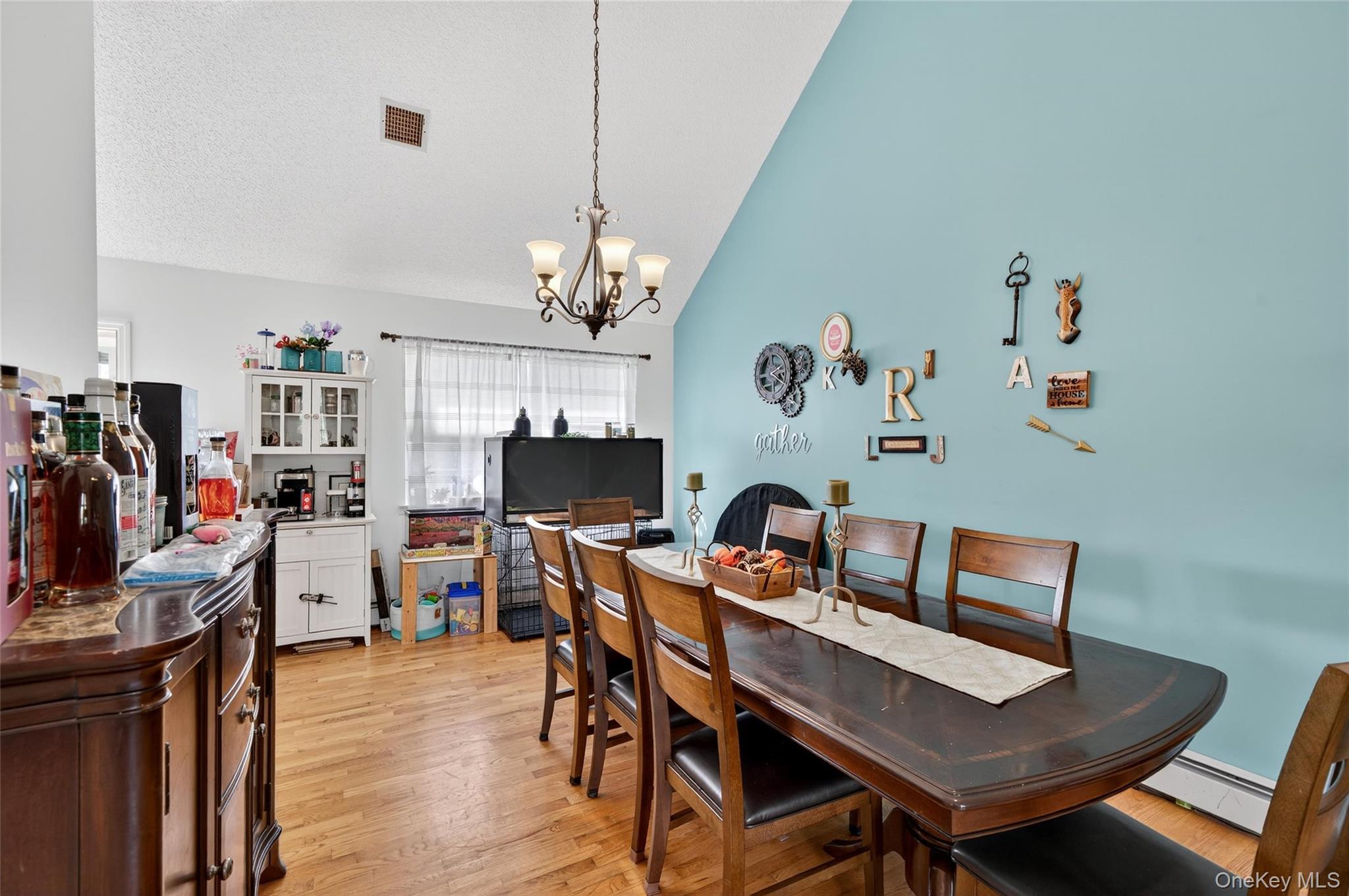 2 Berkeley Court Highland Mills, NY 10930 - Photo 11 of 44 a view of a dining room with furniture and chandelier