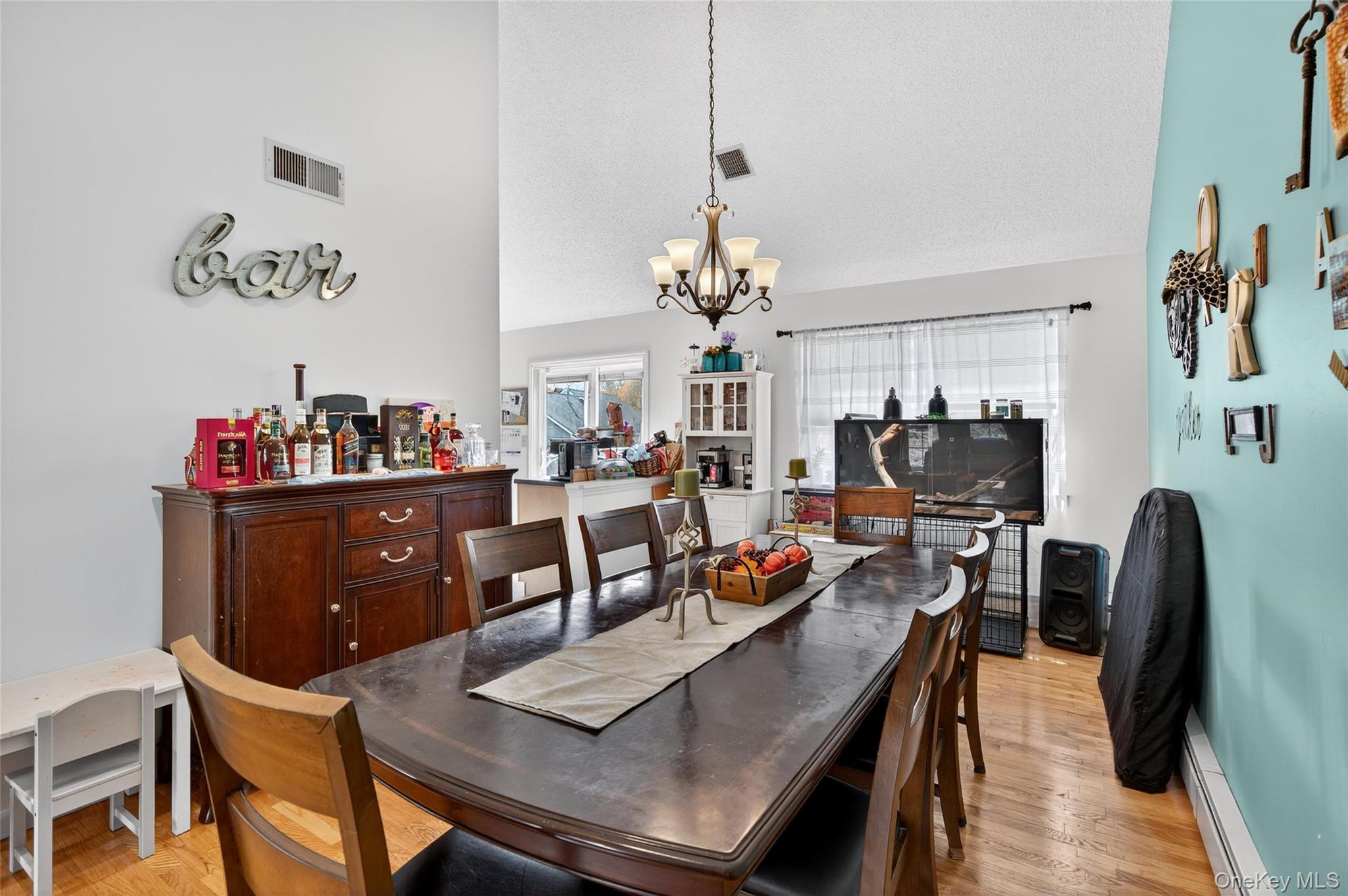 2 Berkeley Court Highland Mills, NY 10930 - Photo 12 of 44 a view of a dining room with furniture and a chandelier