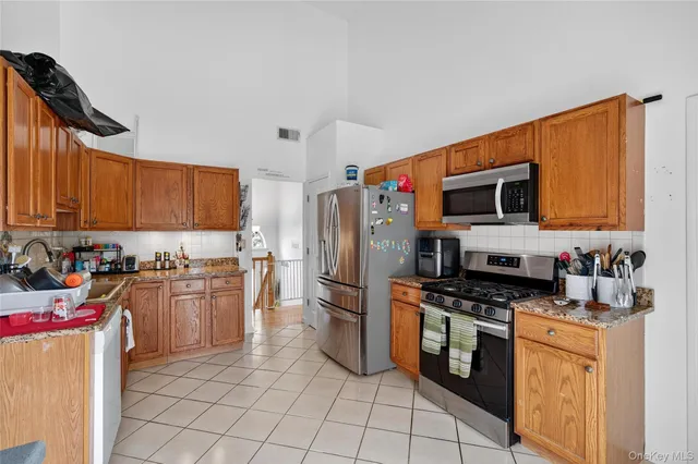 a kitchen with a sink a stove and refrigerator